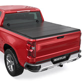 99-07 Silverado Sierra Red pickup truck equipped with a MOSTPLUS FRP hard quad-fold tonneau cover fully closed over the bed