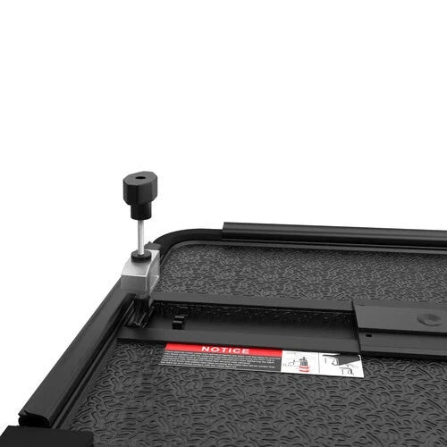 MOSTPLUS 04-15 Nissan Titan fiberglass quad-fold tonneau cover showing the built-in clamp and textured surface.